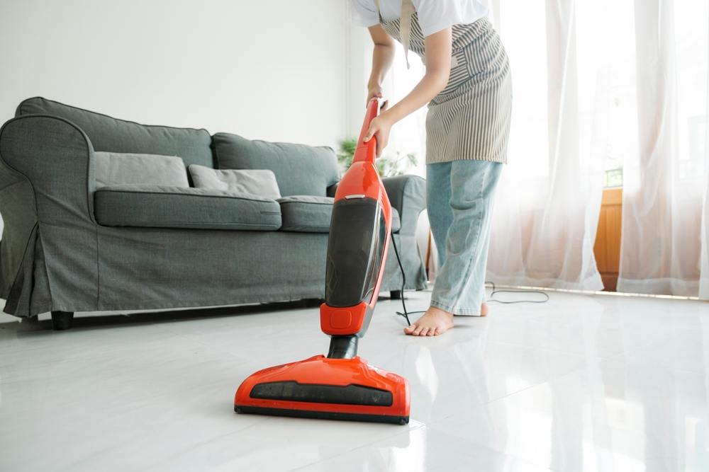 Woman vacuuming her living room floor